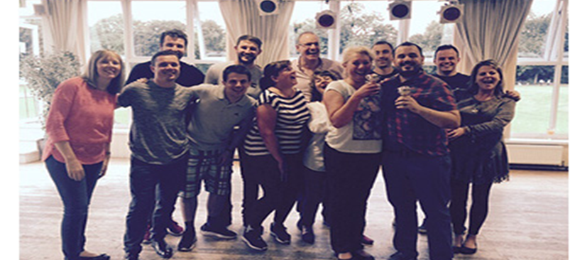 Group of adults learning Ballroom dance hold for the first time