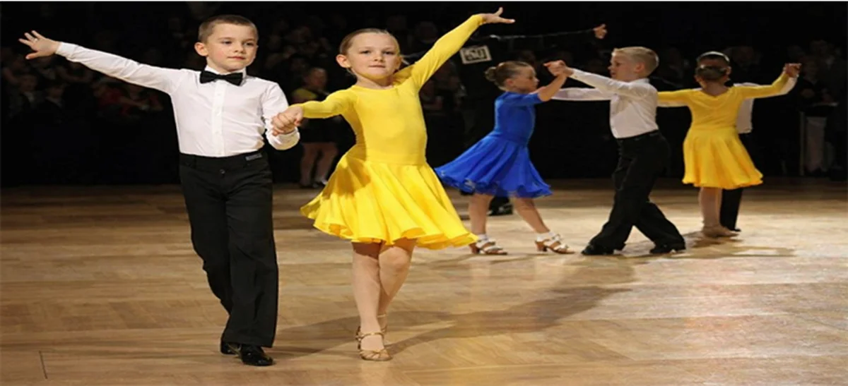 Young dancer in white dress practicing Latin dance