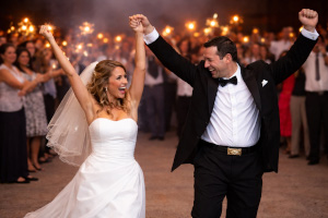 Wedding guests celebrating as the couple dance together